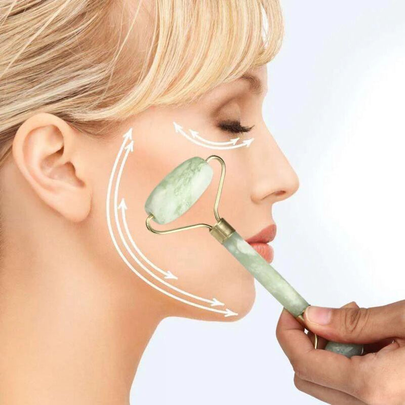 Masajeador facial. rodillo de jade